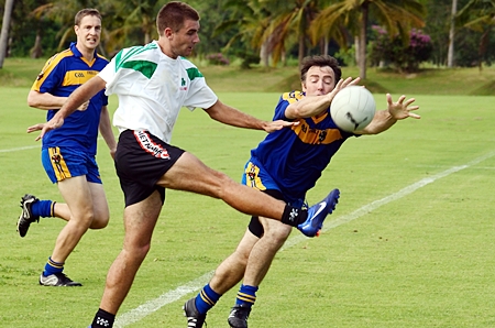 Malaysia charge down a kick in one of the preliminary matches.