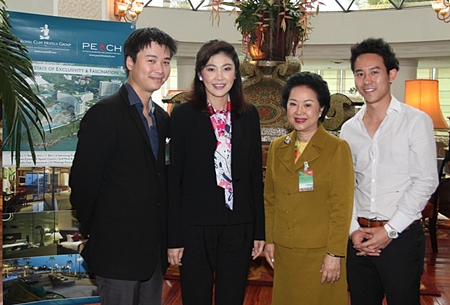 Prime Minister Yingluck Shinawatra personally expressed her sincere gratitude to Royal Cliff Hotels Group Managing Director Panga Vathanakul (2nd right) and her sons Vice-President Vathanai Vathanakul (left) and Executive Director Vitanart Vathanakul (right) for the high quality services, cuisine and excellent set-up in the meeting rooms during the 5th Mobile Cabinet Meeting held in Pattaya on June 18-19.