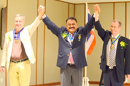 PDG Peter proclaims Joseph Roy (right) as president and Yves Echement as past president.