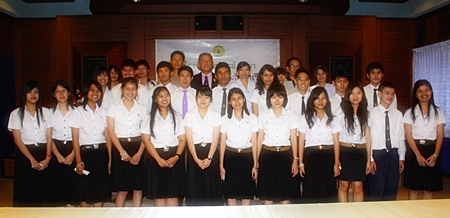 Former students of Maryvit Pattaya who have passed university level examinations pose for a group picture with school officials and teachers. 