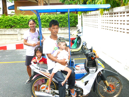 Flook’s family gathers around the bike with the new sidecar.