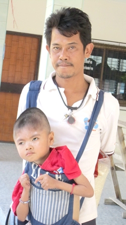 Previously, Somchai had to get around on his motorbike with his 8-year old son, Flook, strapped to his shoulders in front of him in an infant carrier.