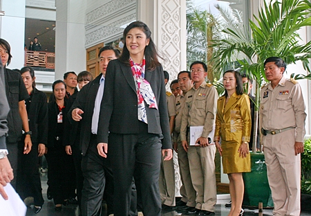 Prime Minister Yingluck Shinawatra arrives at the Royal Cliff for her second day of meetings. 