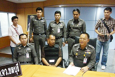 Police have arrested Thanuu “Nu Makhamkhu” Klanthut (seated, center), the last remaining suspect in the 2008 killing of a car care executive. 