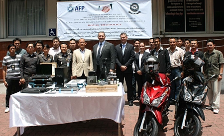 Australian law enforcement officials donate 300,000 baht in equipment to Thailand Region 2 police. 