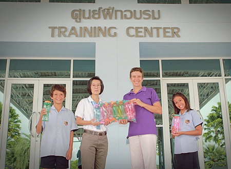 Choawanee Panpruk, Social Enterprise Manager from sponsors PTTCG, gave 300 water bottles to Miss Lucy for GIS students to use at the Games. 