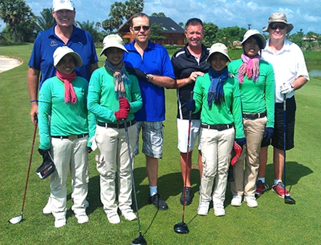 From left: Jim Smith, Clyde Smith, Martin Kingswood & Bill Rogers with their caddies at Angkor Golf Resort.