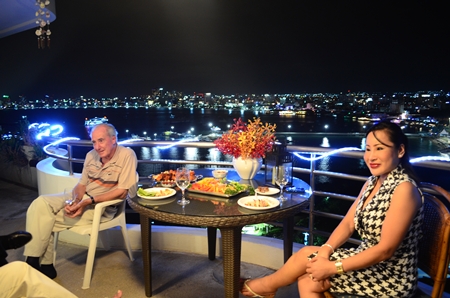 Dr. Iain and Pim enjoy the Pattaya Bay view.