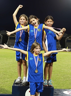 Year 4 girls Gold medal relay team (from left) Inez, Tessa, Jessica, and Golate (front).