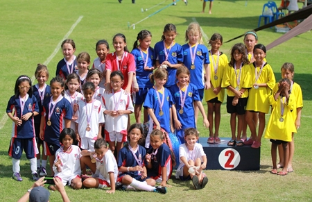 Football Champions (top left) Fiona, Jessica, Lily, Golate, Inez, and Tessa (front: sitting).