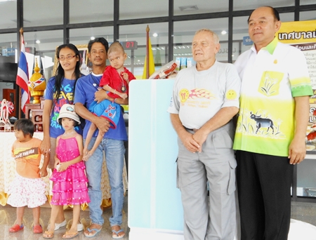 Somchai and his family with the disabled boy, Flook, who we provided with a side car for his motorcycle and now a refrigerator. Bernie and Nongprue Deputy Mayor Anek Patana-Ngam are standing to the right.