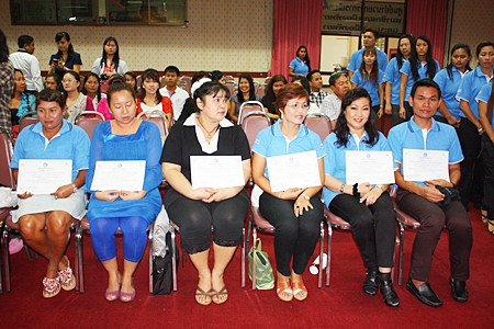 Local folks who passed the foreign language program wait to accept their certificates. 