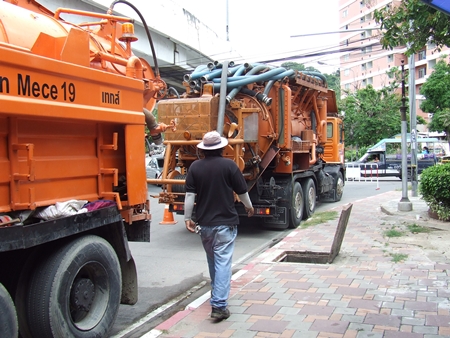 City workers move in heavy equipment to clean out the drains, hoping to prevent flooding during this year’s rainy season. 