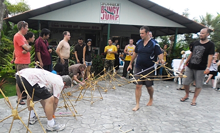 Nearly 40 Thai and foreign staff divided into six teams to compete in a sequence of mental and physical challenges.