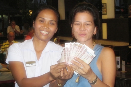 A happy Bling, left, – the 50/50 draw winner.