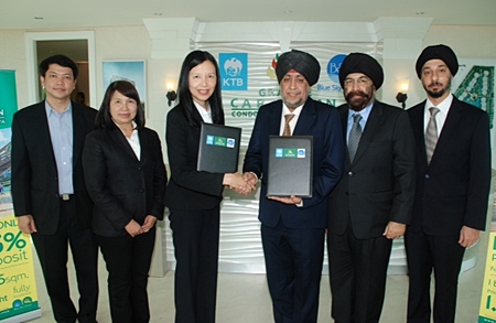 Surjeet Singh Chawala, Director of Blue Sky Group (4th from left) and Jaree Wuthisanti, Krung Thai Bank Senior Executive Vice President Corporate Banking Group 1 (3rd from left) shake hands on the 1,150 MB loan agreement to support Grande Caribbean Condo Resort Pattaya.  