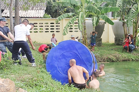 Thanks to the Thai and US navies, they were able to drain the tank and remove it from the pond.