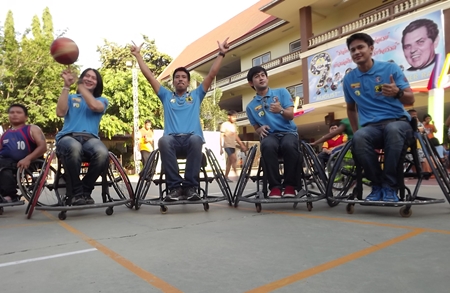 Channel 3 celebrities show off some wheelchair basketball skills.