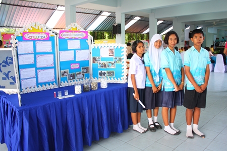 (L to R) Pisunee Teechuen, Nattakan Khonthun, Supanee Sreehuahae and Pakorn Saensa-ad, stand at their booth to present their works to the Diamond Level Health Assessment committee.