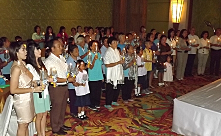 Guests at the party sing a candlelight song to honor HM the Queen and all mothers for Mother’s Day.