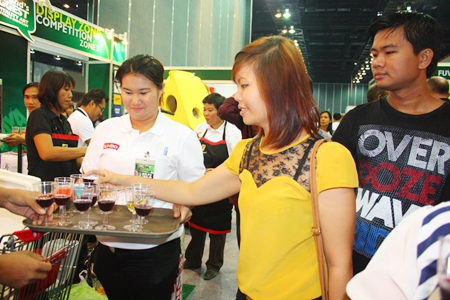 Guests visiting the Big C Jumbo booth are treated to a wine tasting. 
