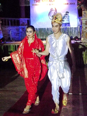Models dressed in Indian bridal costumes walk the runway during the fashion show.