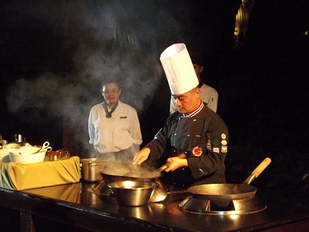 Renowned chef, Peter Lai, displays his cooking skills during the grand opening.