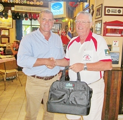 Simon presents the monthly prize to Dick Warberg.