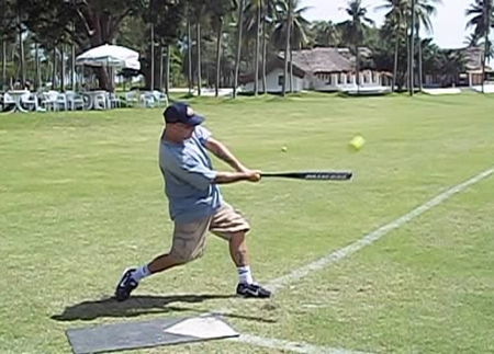 Greg Kahn powers one down the left field line.