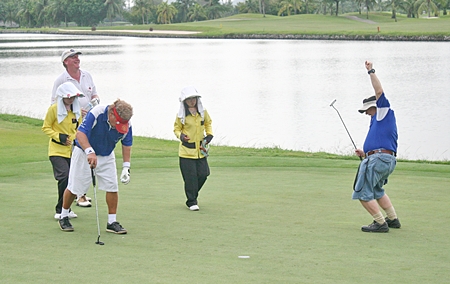 Celebrations on the green – another putt drops.