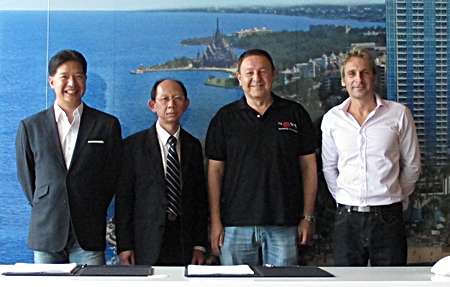 From left:  Birathon Kasemsri Na Ayudhaya (Partner), Sommai Ungsrithong (SCB Commercial Banking), Rony Fineman and Winston Gale (Partners/Developers) pose for a photo at a signing ceremony held, August 17, to complete the finance agreement for construction of The Palm luxury development at Wongamat Beach. 