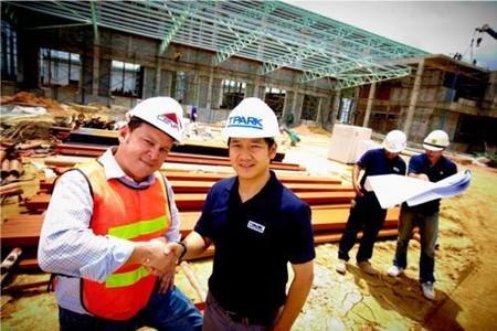 Russell Pang, Country Business Development Director of CEVA Logistics (Thailand) Limited (CEVA), left, and Patan Somburanasin, General Manager of TICON Logistics Park Co., Ltd (TPARK), inspect progress at the construction site of CEVA Logistics new facility in Laemchabang. 