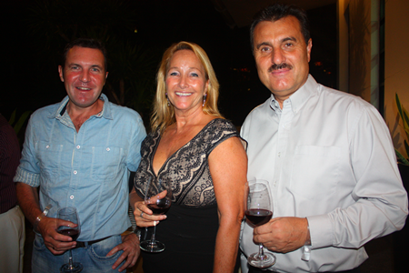 (L to R) Paul Wilkinson, along with Roseanne and Michael Diamente sample the wine before dinner.