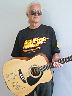 Jimmy Page came back to play some more on the guitar he is donating. 