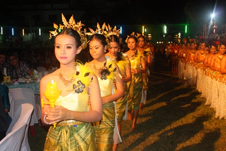In a grand procession, students carry in a student with the royal award to be presented to school officials.