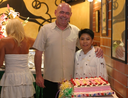 Stewart Fraser prepares to blow out the candles on the birthday cake.