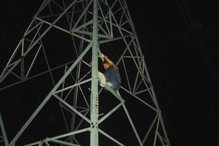 Wijit Saothong climbed an electricity tower and refused to come down. 