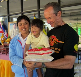 Jesters sponsor a monthly rice and milk distribution to poor families with disabled children, at Nong Prue Municipality.