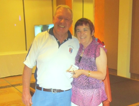 A happy 50/50 winner Maggie Fitzgerald, right, with Golf Chairman, Joe.