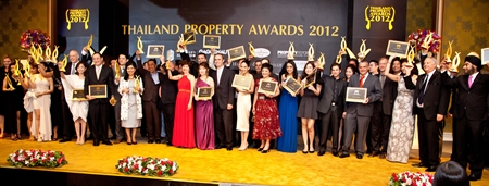 Winners pose on stage with their awards at the Dusit Thani Hotel, Bangkok.