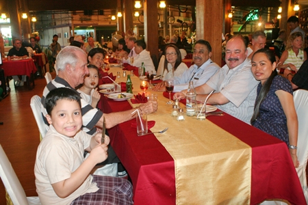 The Corness family (left) along with Peter Malhotra and the Levy family prepare for an evening of good food and fun.