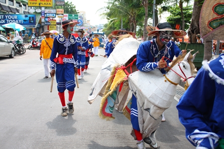 A man on his horse “rides” down Beach Road during the opening day parade.