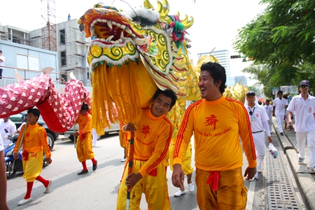 A pair of dragons weave their way down Beach Road.