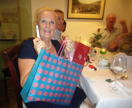 Brenda Bradbrooke with her prize and her lucky pen.