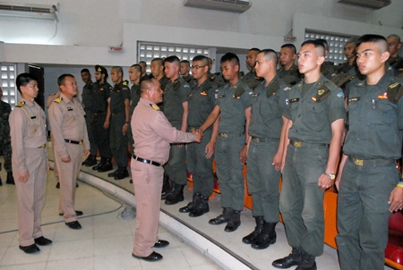 Capt. Chusak Bunthat congratulates students of the Thai Marine Corps Officer Advanced Training course. 