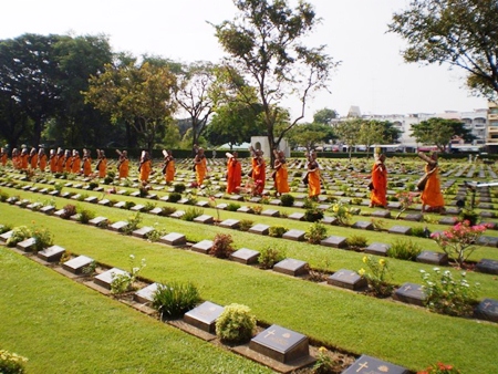Buddhist monks bless all the graves before our Remembrance Service.