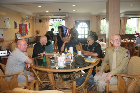 Members enjoy coffee and beer among family and comrades.
