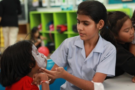 Secondary students helped primary with their face-painting.