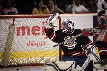 Farang netminder Dean Tzembelikos makes another save against Abu Dhabi Storm.