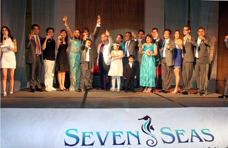 Sonia Punjabi (5th left) and Rajesh Punjabi (6th left) pose with fellow directors, sponsors and VIP’s on stage to welcome party attendees at the launch of Seven Seas.